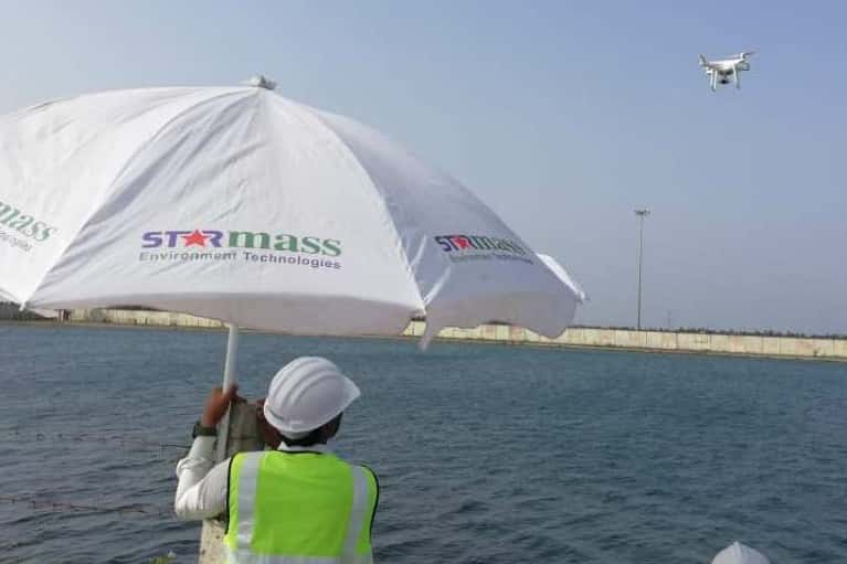 Starmass field team carrying out a leakage audit near a refinery water basin.
