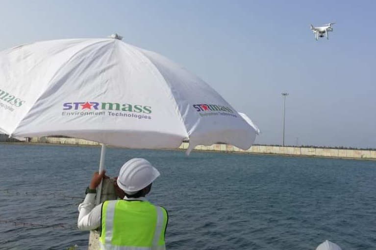Starmass field team carrying out a leakage audit near a refinery water basin.