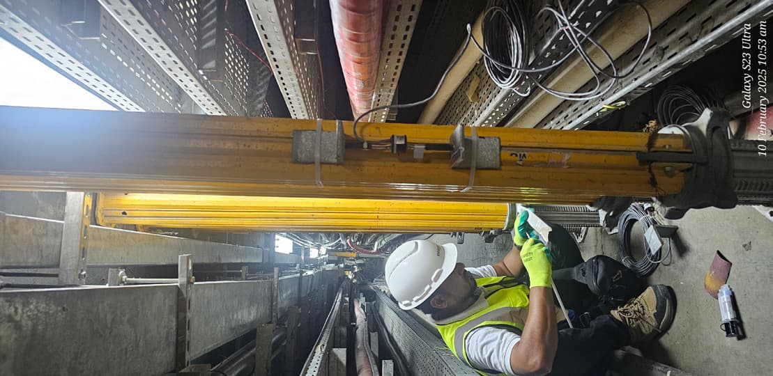 Embedded utilities mapping work in a built environment with technicians documenting field conditions.